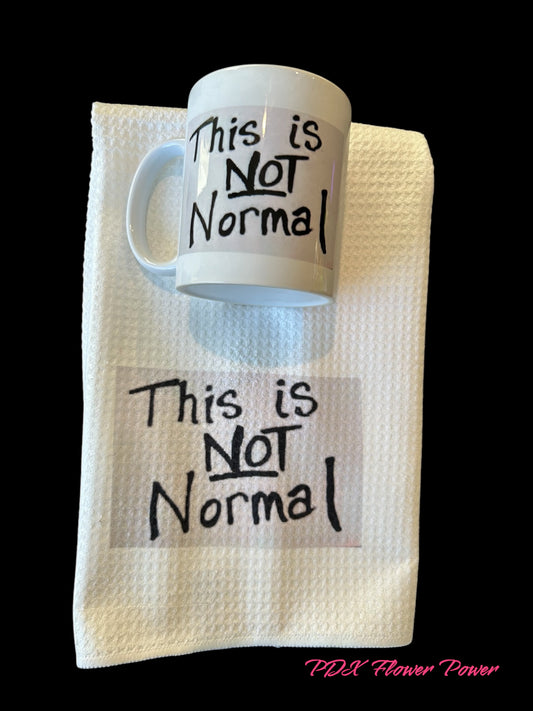 "This is Not Normal" mug &  dish towel set, featuring NM Representative Melanie Stansberry's sign