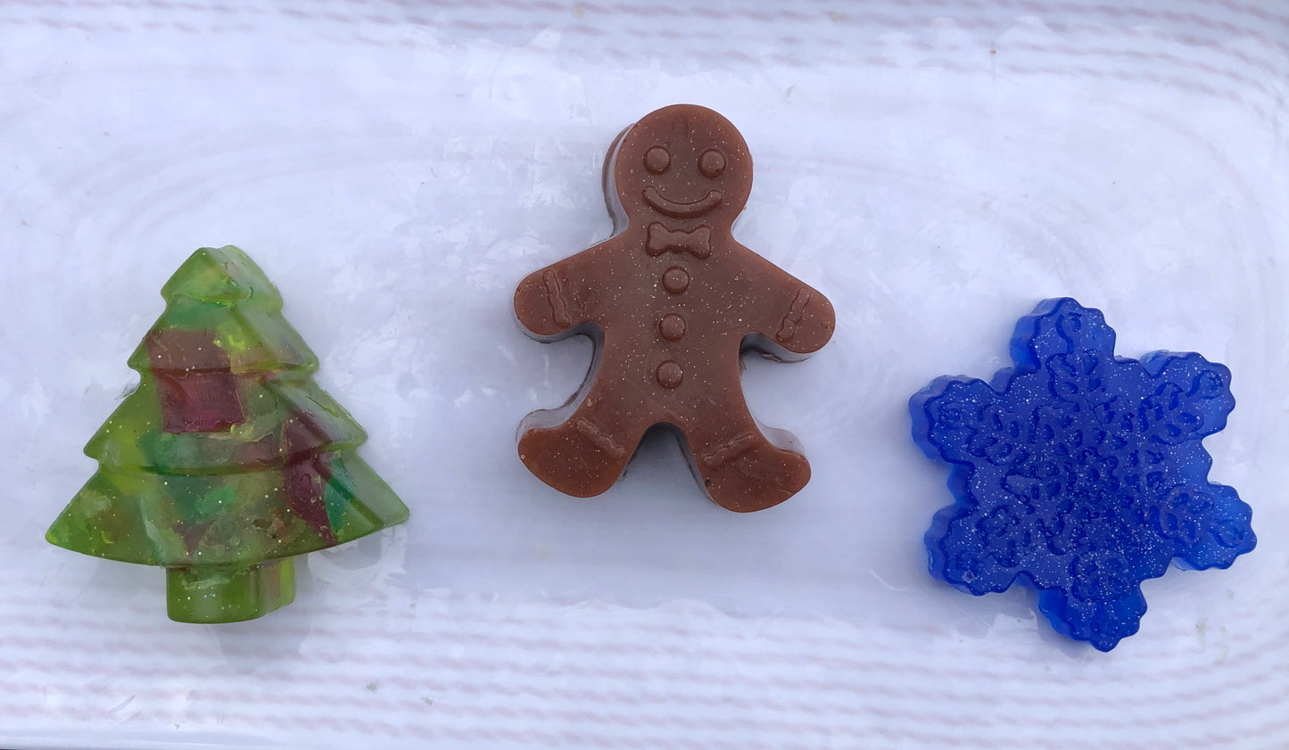 Holiday soap set. Gingerbread man, Snow flake and festive tree.