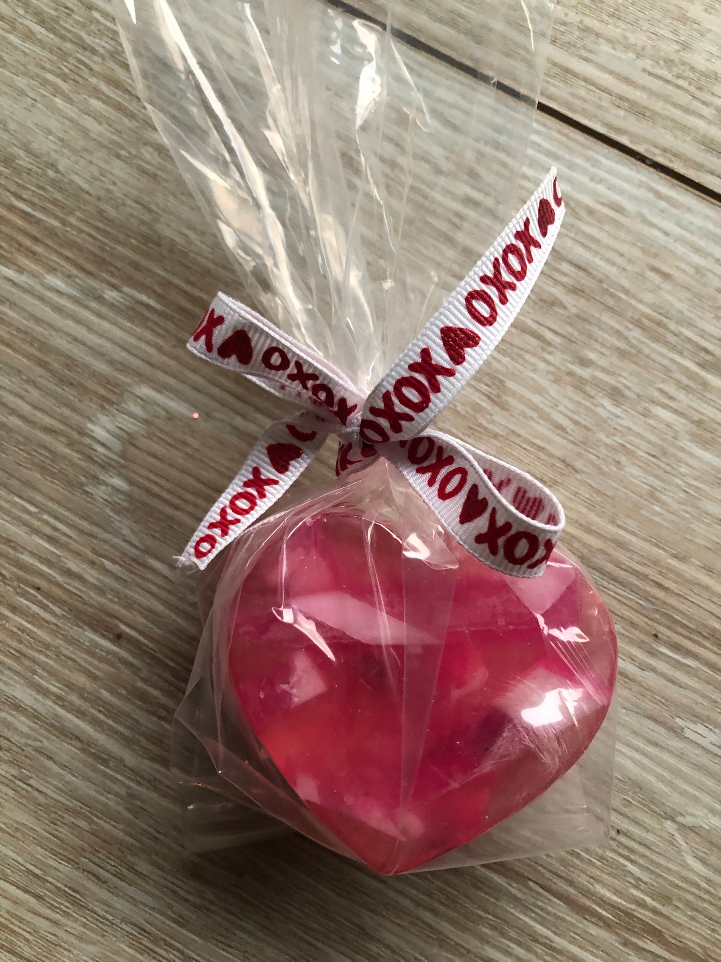 Fun and festive Valentine heart soap in cello bag with xoxo tie.